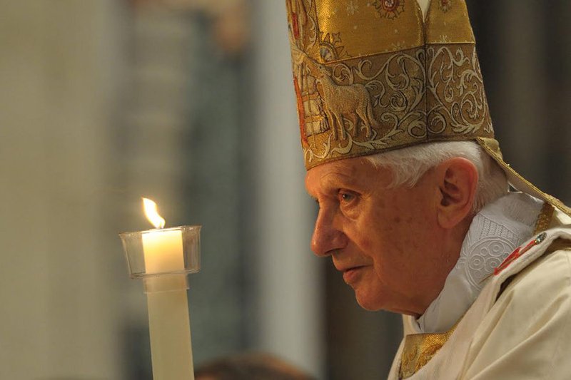 Benedict XVI holds the paschal candle during the Easter Vigil