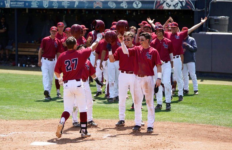 LMU's baseball team celebrates after a game this season. (PHOTO COURTESY LMU BASEBALL TWITTER)