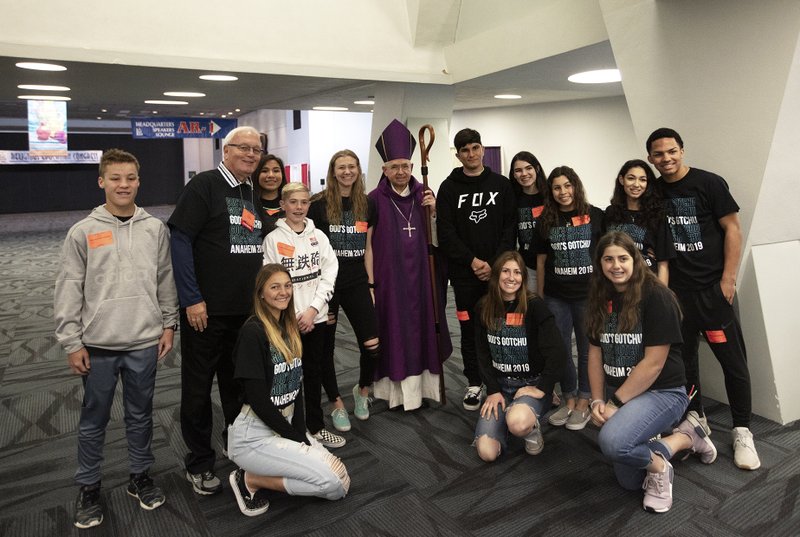 Participants gather with Archbishop Gomez during the Youth Day celebration March 21. (VICTOR ALEMÁN)