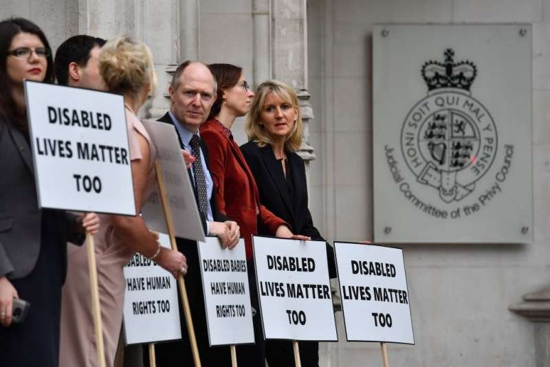 Pro-life demonstrators protest outside the supreme court in London where judges ruled on an appeal against Northern Ireland's abortion laws June 7