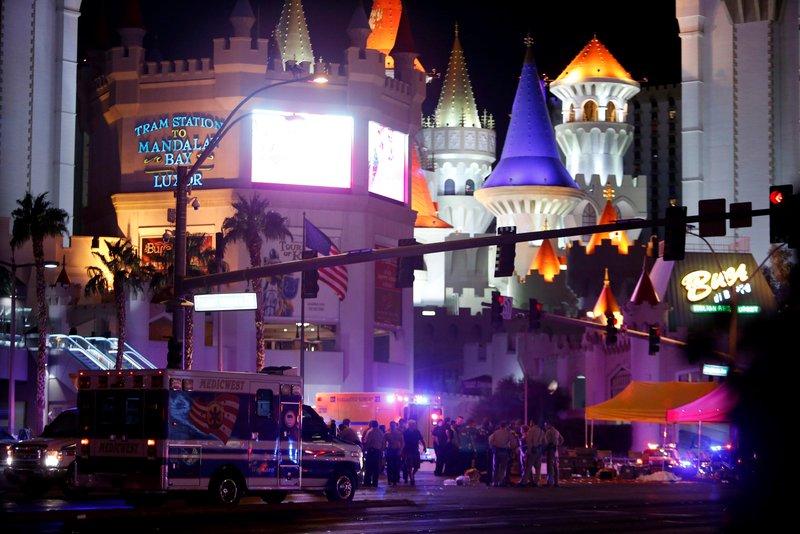 A body is covered with a sheet in the intersection of Tropicana Avenue and Las Vegas Boulevard South after an Oct. 1 mass shooting at a music festival on the Las Vegas Strip. A gunman perched high on the 32nd floor of a casino hotel unleashed a shower of bullets on an outdoor country music festival below