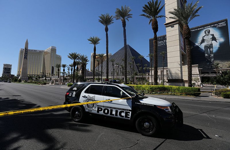 Police crime scene tape marks a perimeter outside the Luxor Las Vegas hotel and the Mandalay Bay Resort and Casino Oct. 2