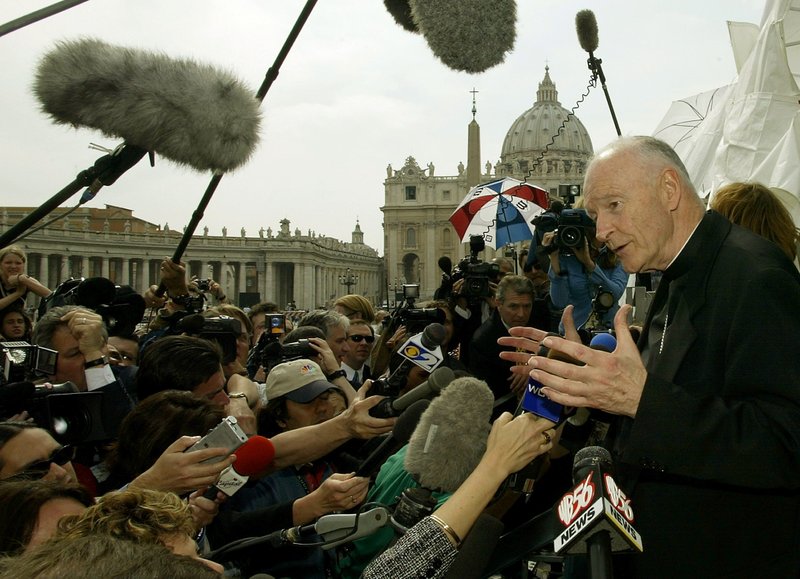 Cardinal Theodore E. McCarrick of Washington faces the press in the shadow of St. Peter's Basilica at the Vatican April 24