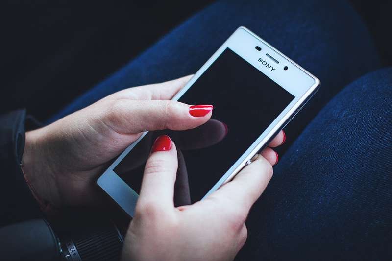 Woman on phone. Credit Pexels CC0 License.