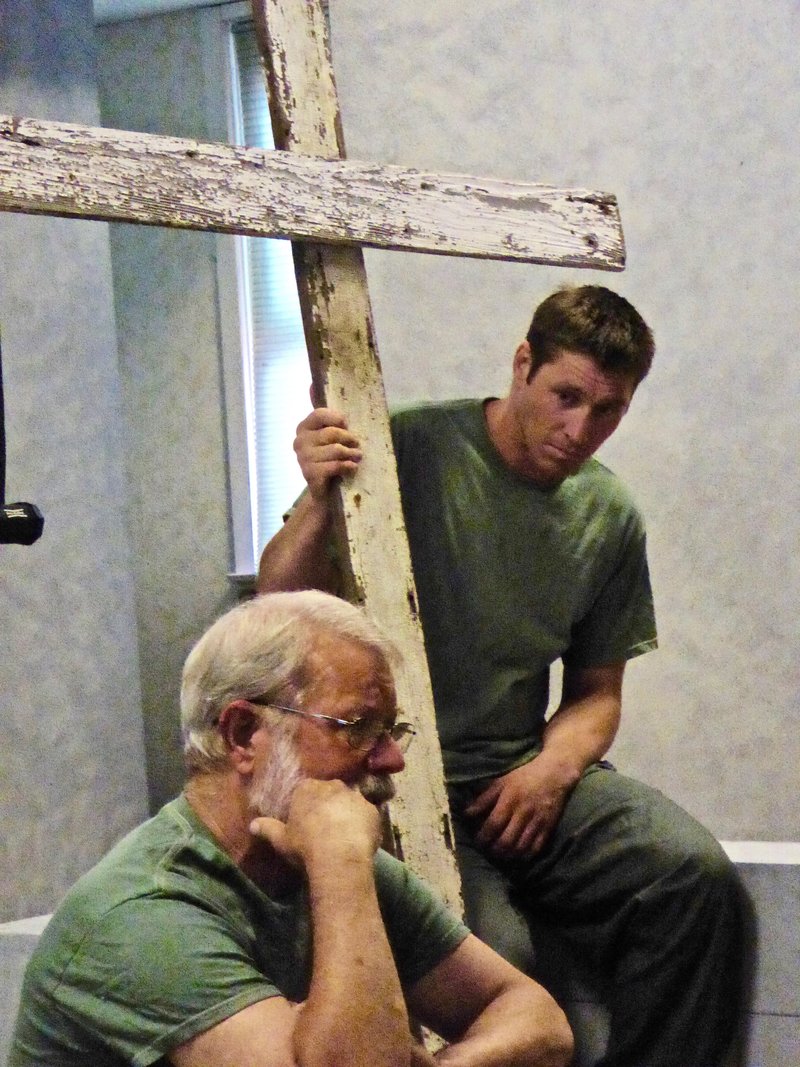 Actors Dennis Apel (left) and Ryan Dunn perform in a recent production of “Crossing the Line.” (CYNTHIA SEMEL)