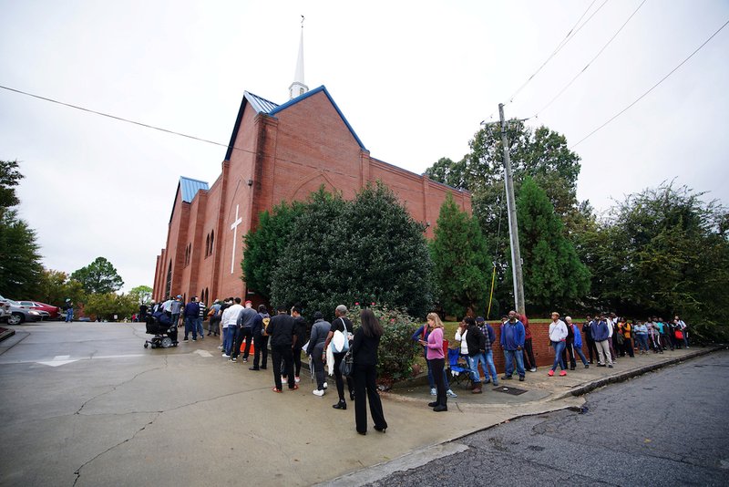 A line of voters wraps around Our Lady of Lourdes Catholic Church in Atlanta during midterm elections Nov. 6. (CNS photo/Lawrence Bryant