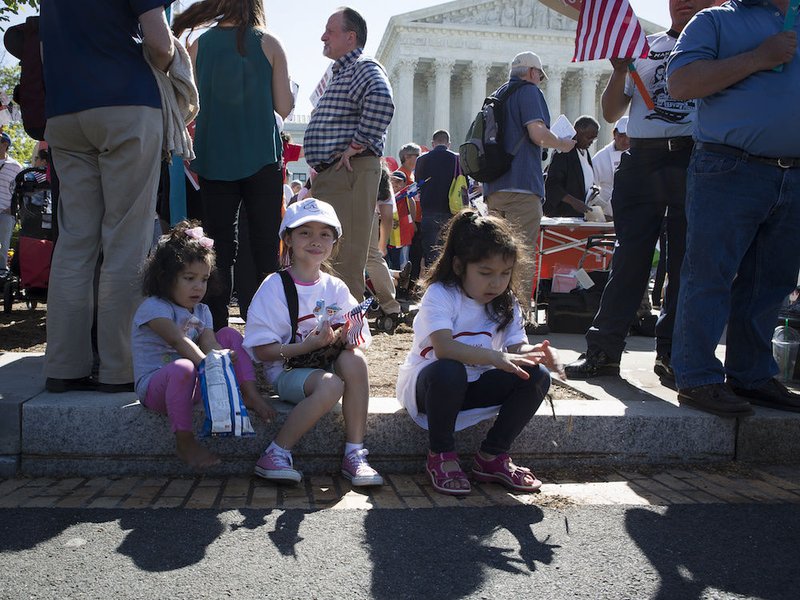 An immigration rally takes place April 18 outside the U.S. Supreme Court in Washington. The U.S. bishops' migration committee chair in a July 18 statement urged President Donald Trump to "ensure permanent protection" for youth under the Deferred Action for Childhood Arrivals program
