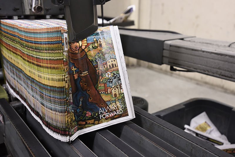 A stack of the debut issue of Angelus News magazine comes off the press. (photo/Tamara Tirado)