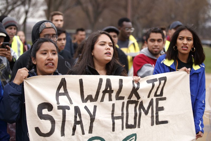 Undocumented youth carry a banner to the U.S. Capitol in Washington March 1 to conclude their 250-mile Walk to Stay Home. Hondurans were pleading for the extension of Temporary Protected Status