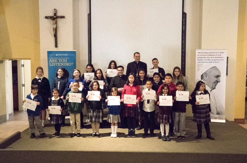 The 2018 vocation poster contest winners with former Auxiliary Bishop Joseph V. Brennan. (Office of Vocations)