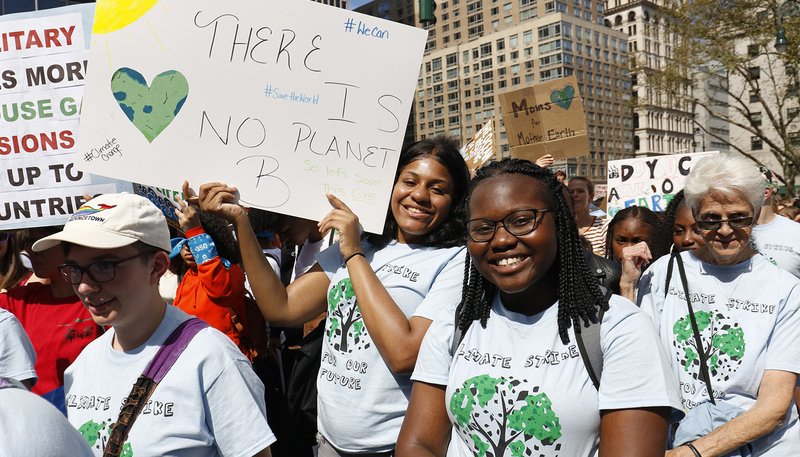Students from St. Joseph High School in Brooklyn, N.Y., smile as they participate in the Global Climate Strike in New York City Sept. 20, 2019. The youth-led march and rally was one of many demonstrations held around the world urging government and business leaders to take immediate action to combat climate change. (CNS photo/Gregory A. Shemitz)