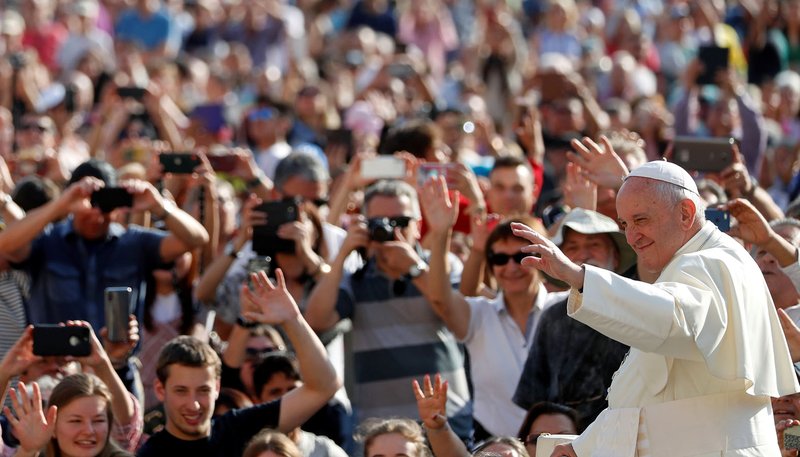Pope Francis greets pilgrims as he arrives for his general audience in St. Peter's Square at the Vatican Oct. 2, 2019. (CNS photo/Yara Nardi, Reuters)