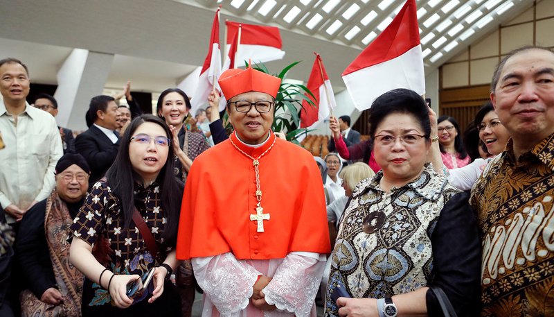 New cardinal Ignatius Suharyo Hardjoatmodjo of Indonesia meets with members of his family after a consistory for the creation of 13 new cardinals at the Vatican Oct. 5, 2019. (CNS photo/Remo Casilli, Reuters)
