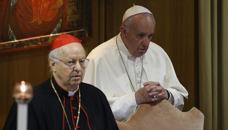 Pope Francis prays at the start of the first session of the Synod of Bishops for the Amazon at the Vatican Oct. 7, 2019. Also pictured is Cardinal Lorenzo Baldisseri, secretary-general of the Synod of Bishops. (CNS photo/Paul Haring)