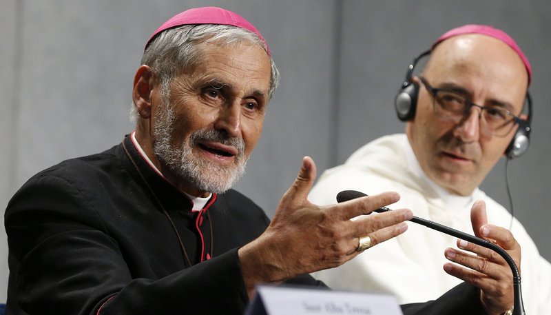 Bishop Emmanuel Lafont, who leads the Diocese of Cayenne in French Guiana, bordering the Amazon River basin, speaks at a news briefing after the first session of the Synod of Bishops for the Amazon at the Vatican Oct. 7, 2019. Looking on is Bishop David Martinez de Aguirre Guinea of Puerto Maldonado, Peru. (CNS photo/Paul Haring)