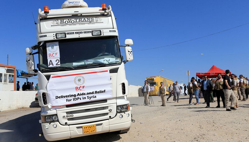 A truck loaded with humanitarian aid is seen in Fishkhabur, Iraq, Oct.15, 2019, heading to Syria for displaced families who fled violence. As of Oct. 15, the United Nations estimates that at least 160,000 people have been displaced, but 400,000 are in need of humanitarian aid as the Turkish military and its allied Syrian rebels, including Islamic State and al-Qaida militants, press deeper into northeastern Syria, battling Kurdish and Syriac Christian forces. (CNS photo/Ari Jalal, Reuters)