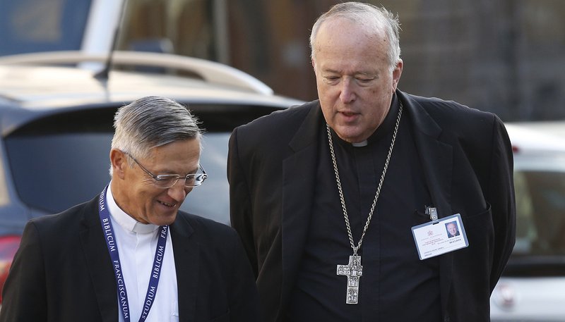 Bishop Robert W. McElroy of San Diego talks with Father Bernardo Estrada as they arrive for a session of the Synod of Bishops for the Amazon at the Vatican Oct. 15, 2019. (CNS photo/Paul Haring)