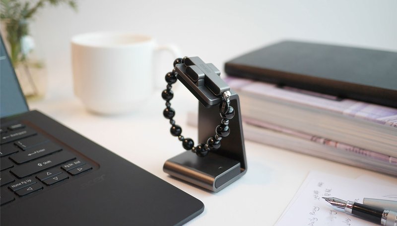 The new Click to Pray eRosary bracelet sits on its charger. The high tech rosary, which connects to a smartphone application, was unveiled at a Vatican news conference Oct. 15, 2019. (CNS photo/courtesy Pope's Worldwide Prayer Network)