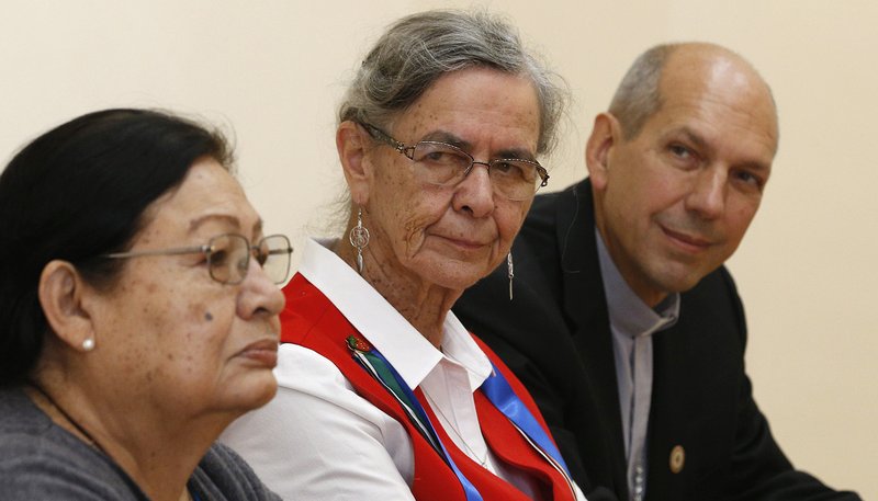 Rita Means, tribal council representative with the Rosebud Sioux Tribe, Sister Priscilla Solomon, a member of the Ojibway people and of the Sisters of St. Joseph of Sault Ste. Marie, and Archbishop Donald J. Bolen of Regina, Saskatchewan, attend a news conference with indigenous leaders from North America in Rome Oct. 17, 2019. Members of the delegation spoke about their own challenges and connections to indigenous people from South America who are meeting at the Synod of Bishops for the Amazon. (CNS photo/Paul Haring)