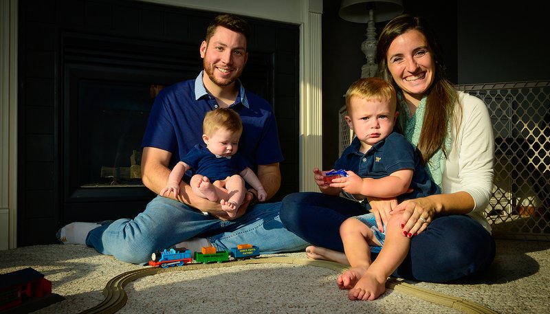 David and Maria Schuette, seen with their sons, 8-month-old Eli and 18-month-old Isaac, are reaching out to other couples considering adoption. The family, who belongs to SS. Peter and Paul Parish in Kiel, Wis., were at the hospitals for each birth and remain in close communication with their sons' birth parents. (CNS photo/Sam Lucero, The Compass)