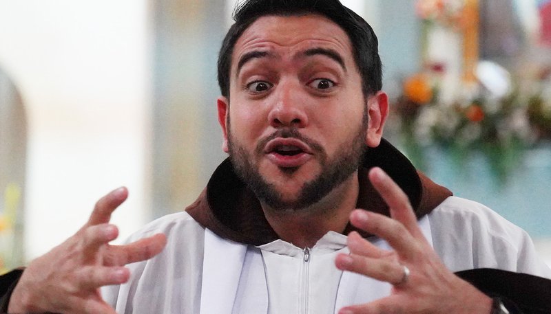 Venezuelan Capuchin Friar Luis Antonio Salazar is seen Oct. 12, 2019, during a baptism ceremony at the Our Lady of Chiquinquira Parish in Caracas. The Friar has become famous for explaining the Bible via short videos posted on Instagram. (CNS photo/Manuel Rueda)