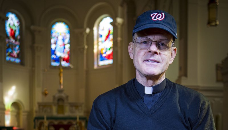 Msgr. Stephen J. Rossetti, a professor at The Catholic University of America and the chaplain for the Washington Nationals, sports some of his baseball gear in a campus chapel Oct. 21, 2019, in support of his team and World Series contenders. (CNS photo/Chaz Muth)