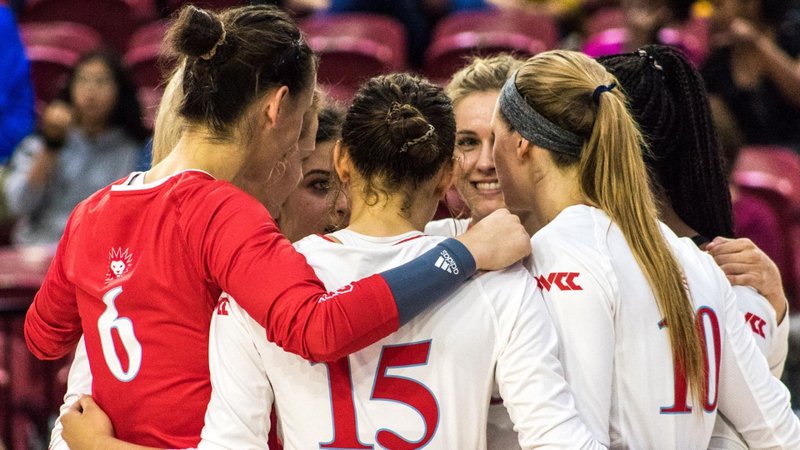 Among the Lions celebrating a point in a recent match are Bo Culo (6), Emma Boehle (15) and Megan Rice (10). The Lions host WCC leaders BYU and San Diego this week. (LMU Athletics)