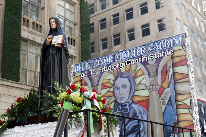 A statue of St. Frances Xavier Cabrini on the Diocese of Brooklyn, New York float during the Columbus Day Parade in New York City Oct. 14. Italian Americans and many others are calling for New York to honor the patron saint of immigrants with a public statue. (GREGORY A. SHEMITZ/CATHOLIC NEWS SERVICE)
