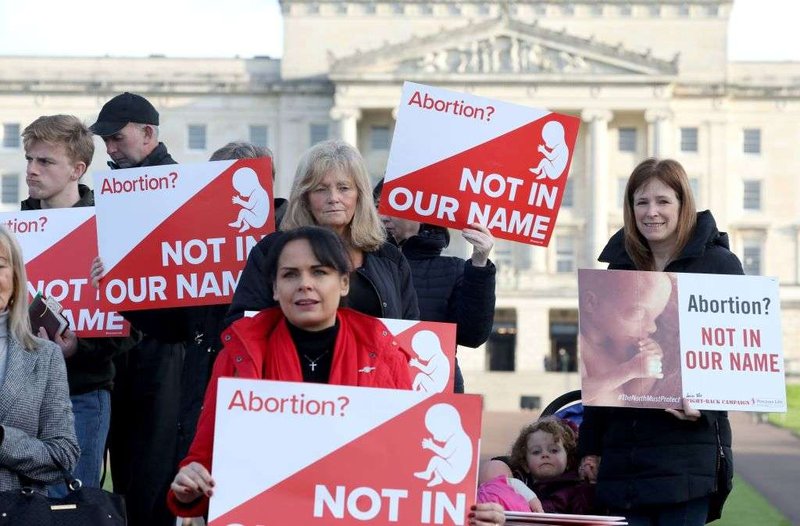 Pro-life campaigners gather with placards at Parliament buildings on the Stormont Estate in Belfast, Oct. 21, 2019. (Paul Faith/AFP/Getty via CNA)