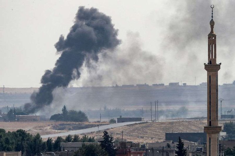 Smoke rises over the Syrian town of Tel Abyad on the Turkish border Oct. 13, 2019. (Burak Kara/Getty Images via CNA)