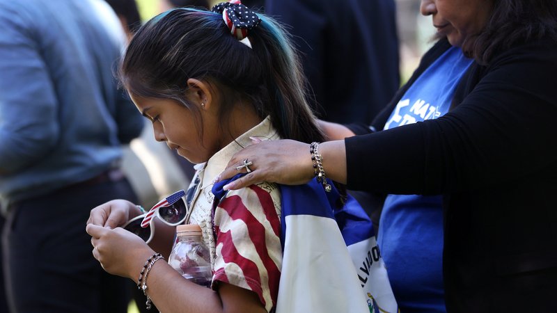 Marilyn Miranda, 9, draped in a Salvadoran flag, attends an immigration rally with her mother outside the U.S. Capitol in Washington June 4, 2019. (CNS photo/Leah Millis, Reuters)