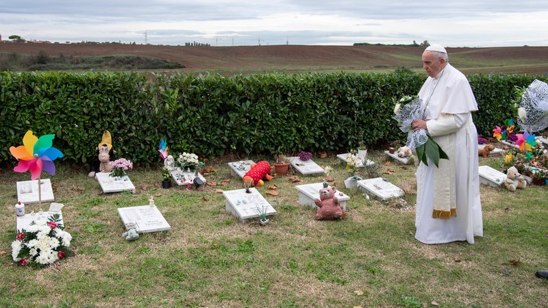 Pope Francis visits graves of children before celebrating Mass marking the feast of All Souls at Laurentino Cemetery in Rome Nov. 2, 2018. (CNS photo/Vatican Media)