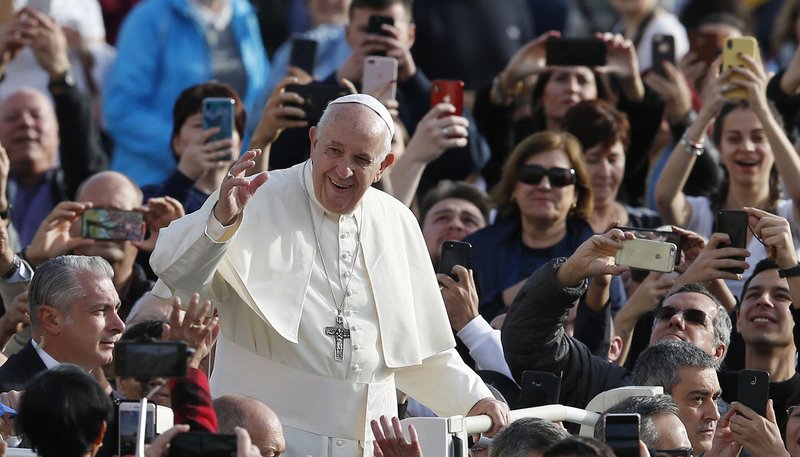 Pope Francis greets the crowd during his general audience in St. Peter's Square at the Vatican Nov. 6, 2019. (CNS photo/Paul Haring)
