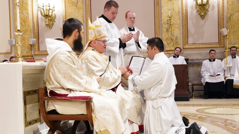 Seminarian Luis Silva of the Archdiocese of the New York makes a promise of obedience to New York Cardinal Timothy M. Dolan during his ordination to the diaconate Nov. 9, 2019, at St. Joseph's Seminary in Yonkers, N.Y. Deacon Silva was one of six seminarians preparing for the priesthood who were ordained transitional deacons at the Mass. Three of the men are from the Diocese of Rockville Centre, N.Y., and two are from the Diocese of Brooklyn, N.Y. (CNS photo/Gregory A. Shemitz)