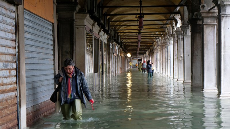 A person walks in the flooded St. Mark's Square in Venice, Italy, Nov. 12, 2019. The square is named after its church, the Basilica of St. Mark. (CNS photo/Manuel Silvestri, Reuters)
