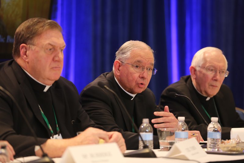 Archbishop Jose H. Gomez of Los Angeles, president-elect of the U.S. Conference of Catholic Bishops, responds to a question during a news conference at the fall general assembly of the USCCB in Baltimore Nov. 12. Also pictured are Cardinal Joseph W. Tobin of Newark, New Jersey, and Archbishop Leonard P. Blair of Hartford, Connecticut. (CNS photo/Bob Roller)