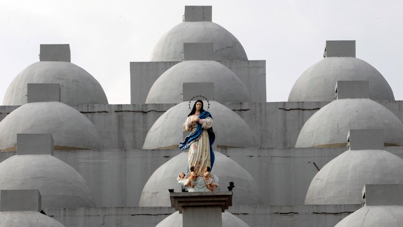 A statue of Mary is seen in 2017 atop the Cathedral of Managua in Nicaragua. On Nov. 18, 2019, a pro-government mob entered the cathedral, damaging property, attacking hunger strikers inside the building and jostling a priest and nun, the Archdiocese of Managua said. (CNS photo/Oswaldo Rivas, Reuters)