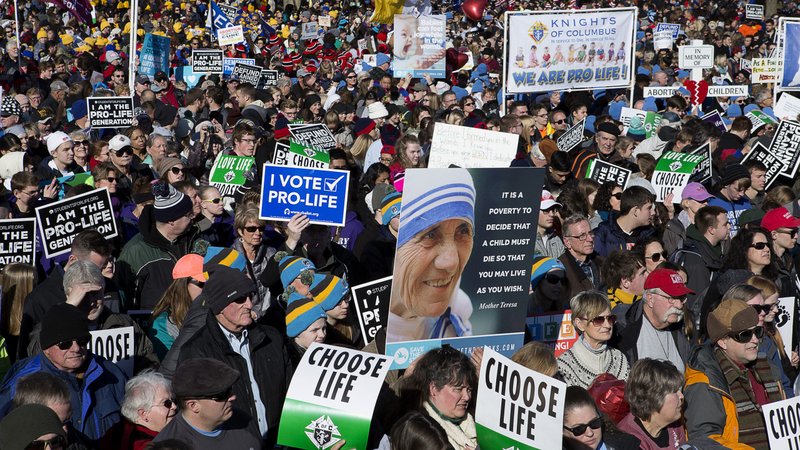 People gather during the annual March for Life rally in Washington Jan. 19, 2018. Archbishop Joseph F. Naumann of Kansas City, Kan., chairman of the U.S. bishops' Committee for Pro-Life Activities, and 17 other pro-life leaders have called on President Donald Trump to block an amendment they say would "enrich global abortion providers," which currently is part of a Senate appropriations measure. (CNS photo/Tyler Orsburn)