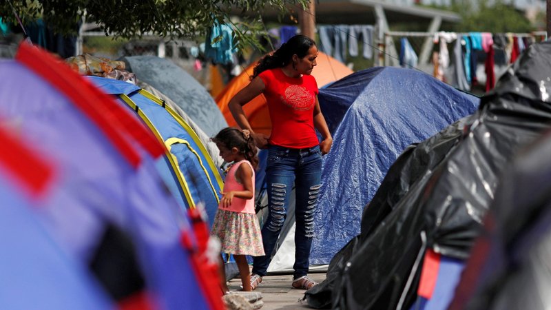 Central American migrants who were returned to Mexico from the U.S. under the Migrant Protection Protocols, are seen Sept. 14, 2019, outside their tent in Matamoros, Mexico, while waiting for their court hearing for asylum. Two Catholic leaders expressed concerned with the federal government's new plan to send Central Americans who want asylum in the U.S. to Guatemala, Honduras and El Salvador where they would be required to apply for U.S. asylum while in one of those countries. (CNS photo//Henry Romero, Reuters)