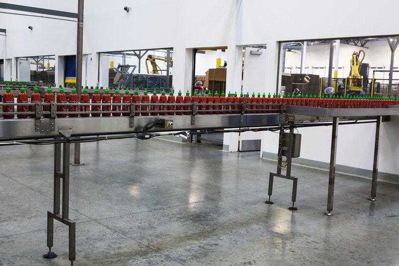Finished bottles on the assembly line at the Sriracha factory. (Shutterstock)