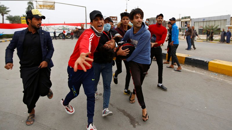 Iraqi demonstrators carry a wounded man during ongoing anti-government protests in Baghdad Nov. 29, 2019. Pope Francis said after the Angelus Dec. 1 he was concerned and saddened following two months of protests in Iraq that resulted in the deaths of hundreds of people. (CNS photo/Alaa al-Marjani, Reuters)