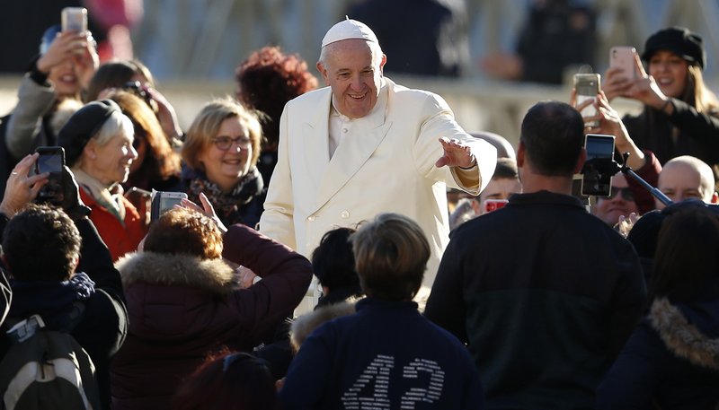 Pope Francis greets the crowd during his general audience in St. Peter's Square at the Vatican Dec. 4, 2019. (CNS photo/Paul Haring)