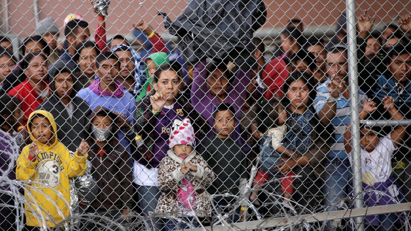 Central American migrants are seen inside an enclosure in El Paso, Texas, March 27, 2019. They were being held by U.S. Customs and Border Protection officers after crossing the U.S.-Mexico border and turning themselves in to request asylum. Under Trump administration policy, the migrants must be returned to Mexico and apply for U.S. asylum from there. Migrants who arrive in Arizona must be bused to El Paso and also taken to Mexico, a policy Bishop Edward J. Weisenburger of Tucson, Ariz., decried Dec. 2 for not protecting "vulnerable people" and for placing them "in significant danger." (CNS photo/Jose Luis Gonzalez, Reuters)