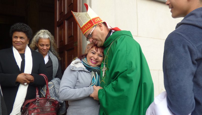 Salvadoran Bishop Oswaldo Escobar Aguilar greets parishioners at the Shrine of the Sacred Heart following Mass in Washington Nov. 10, 2019. At 51, Bishop Escobar is El Salvador's youngest bishop and one greatly influenced by the country's St. Oscar Romero and his devotion to the poor. (CNS photo/Rhina Guidos)