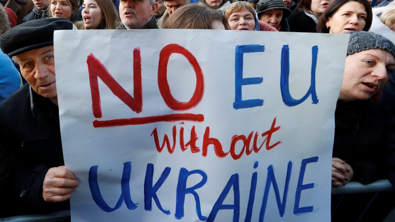 People take part in a rally in Kyiv, Ukraine, Dec. 8, 2019, ahead of the so-called "Normandy Summit" in Paris, where leaders of Ukraine, Russia, Germany and France will meet to discuss steps to resolve the conflict in eastern Ukraine. Pope Francis offered prayers for the summit. (CNS photo/Valentyn Ogirenko, Reuters)