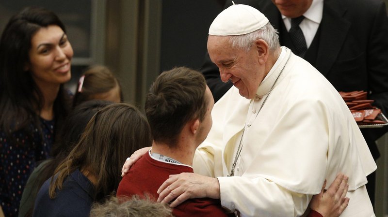 Pope Francis embraces a man as he meets the disabled during his general audience in Paul VI hall at the Vatican Dec. 11, 2019. (CNS photo/Paul Haring)