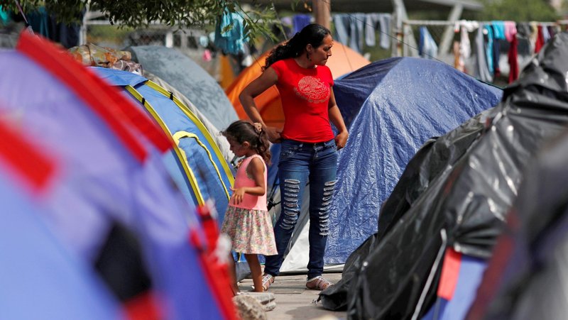 Central American migrants who were returned to Mexico from the U.S. under the Migrant Protection Protocols, are seen Sept. 14, 2019, outside their tent in Matamoros, Mexico. Sister Norma Pimentel, a member of the Missionaries of Jesus, who is executive director of Catholic Charities of the Rio Grande Valley in Texas and a longtime advocate for immigrants and refugees, said about 2,000 families have camped out on the Mexico side in Matamoros while they wait to be called for their asylum cases. (CNS photo//Henry Romero, Reuters)
