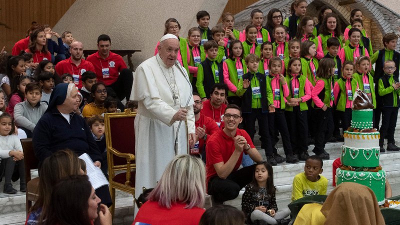 Pope Francis speaks with children served by the Vatican's St. Martha pediatric clinic as well as staff and volunteers during a special pre-Christmas meeting Dec. 22, 2019, in the Vatican audience hall. (CNS photo/Vatican Media)
