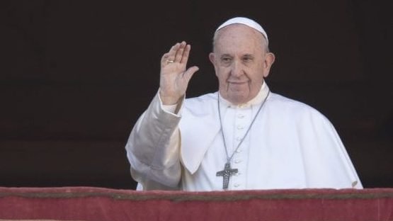 Pope Francis waves to faithful as he arrives to deliver the Urbi et Orbi (Latin for 'to the city and to the world' ) Christmas day blessing from the main balcony of St. Peter's Basilica at the Vatican, Wednesday, Dec. 25, 2019. (Alessandra Tarantino/AP via Crux)