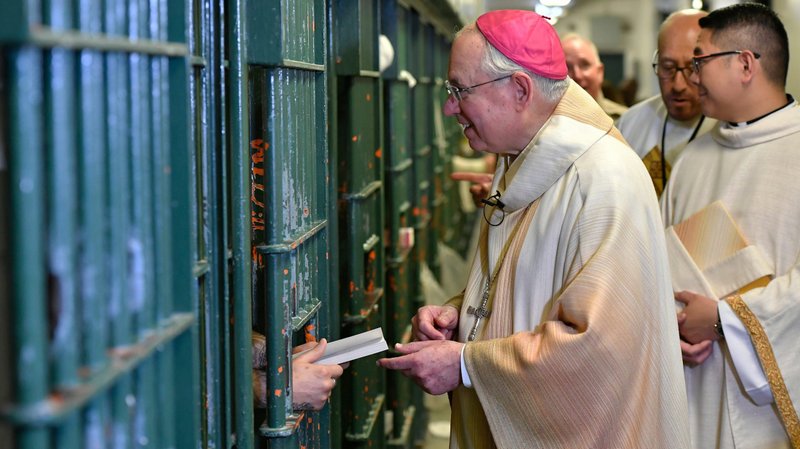 Archbishop José H. Gomez visits inmates after Christmas Mass in the restrictive housing unit of Men's Central Jail, where the most dangerous inmates are housed. (John McCoy)